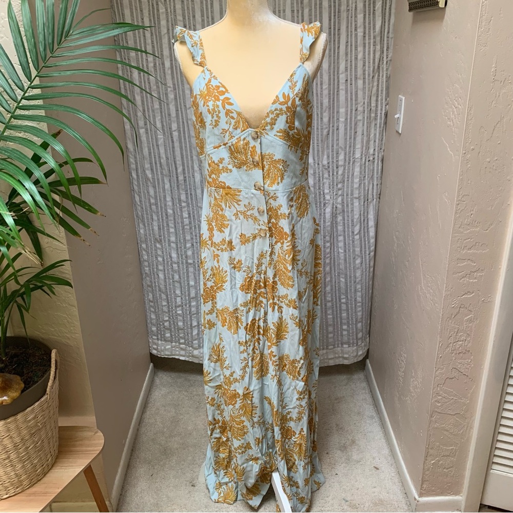 Free People elegant jumper. Robins egg/seafoam and gold colored pattern.
